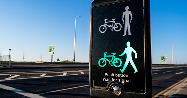 Pedestrian crossing signal, green man and bike