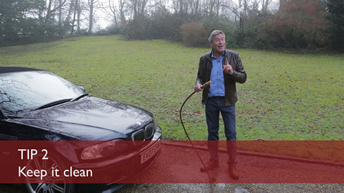 Tiff Needell cleaning his car