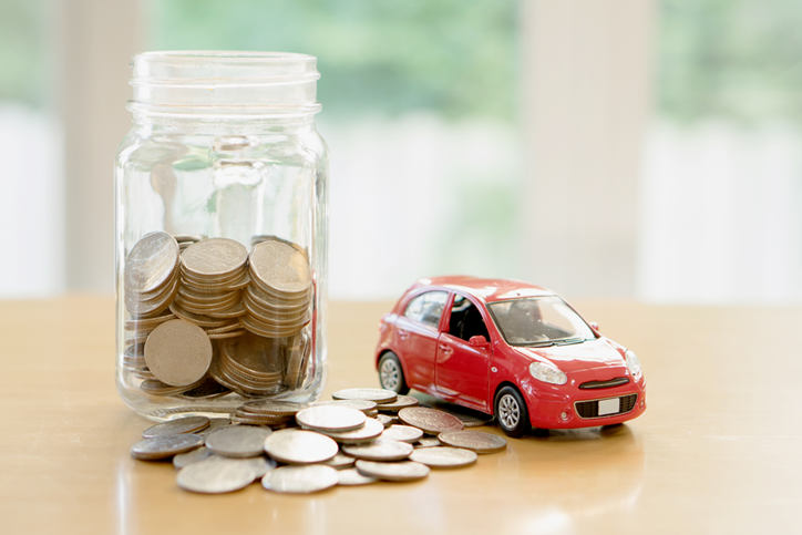 Jar of coins and a toy car