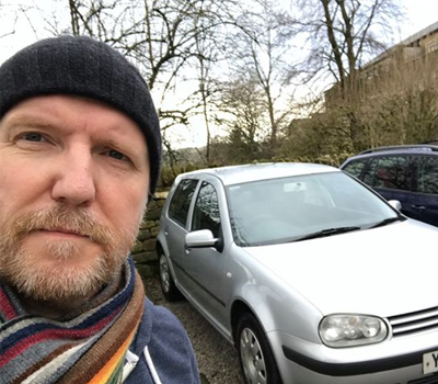 Selfie of a man with his old car