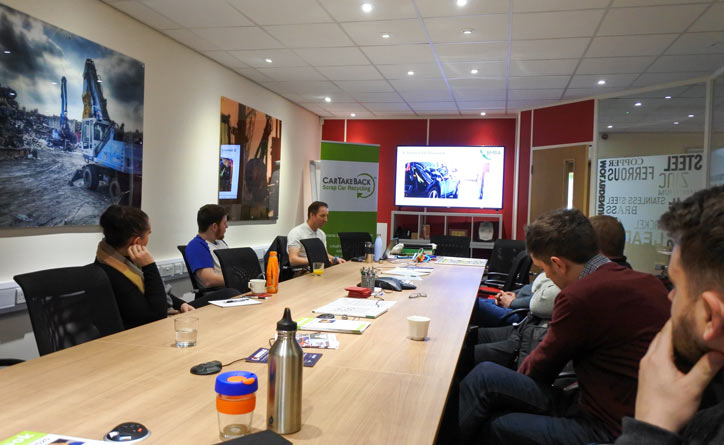 Meeting room with CarTakeBack delivering EV training