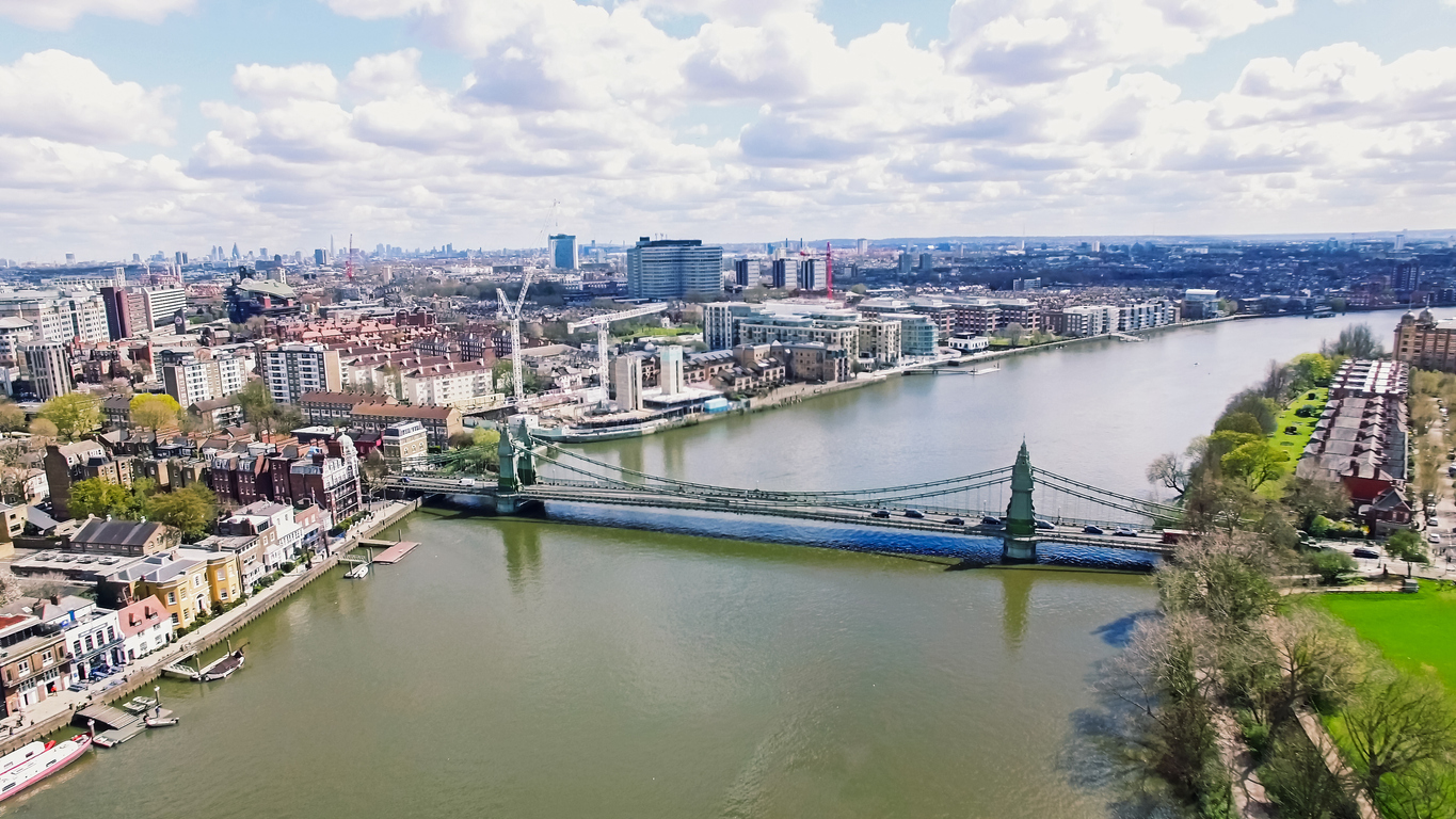 Aerial 4K Urban View Image Photo of Thames River and Hammersmith Bridge in City of London England UK