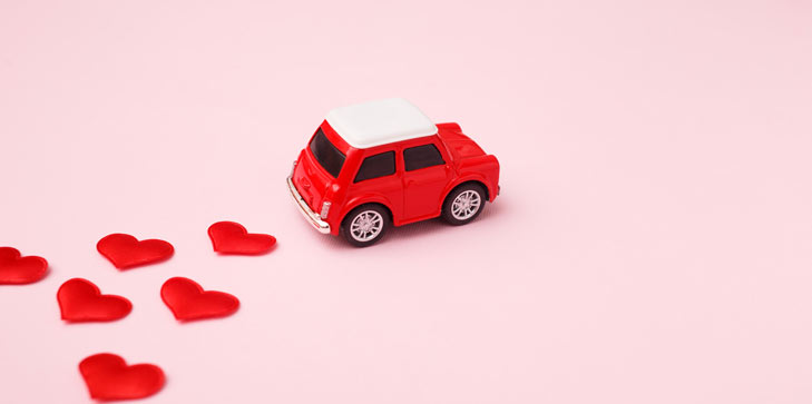 Red hearts and a red toy car