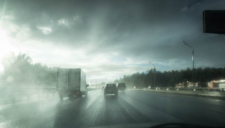 Stormy weather and road with vehicles