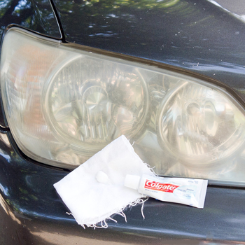 Toothpaste and a cloth on a car headlight