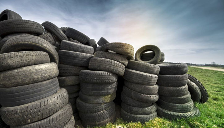 Pile of tyres in a field